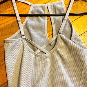Gray tank top. Tight fit